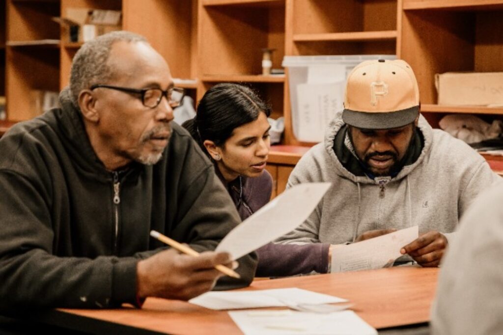 Don Wilkerson works with a student at Indy Reads.