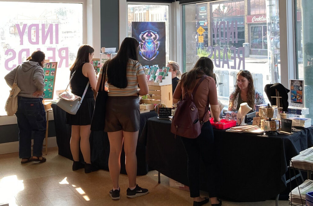 Patrons mingle with vendors at an event