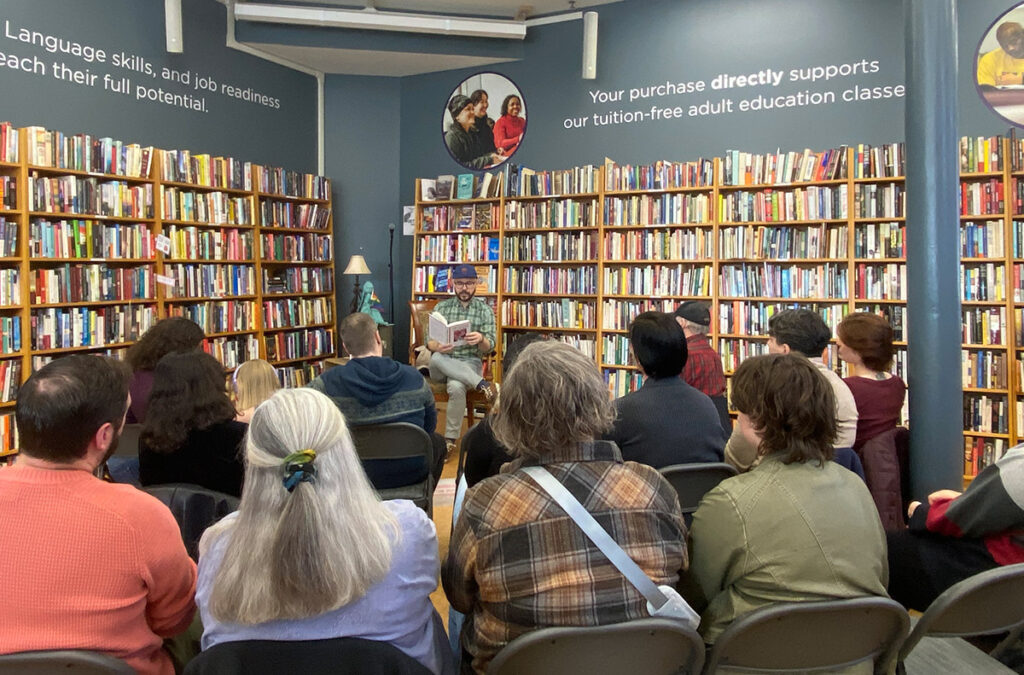 An author reads from a book at Indy Reads
